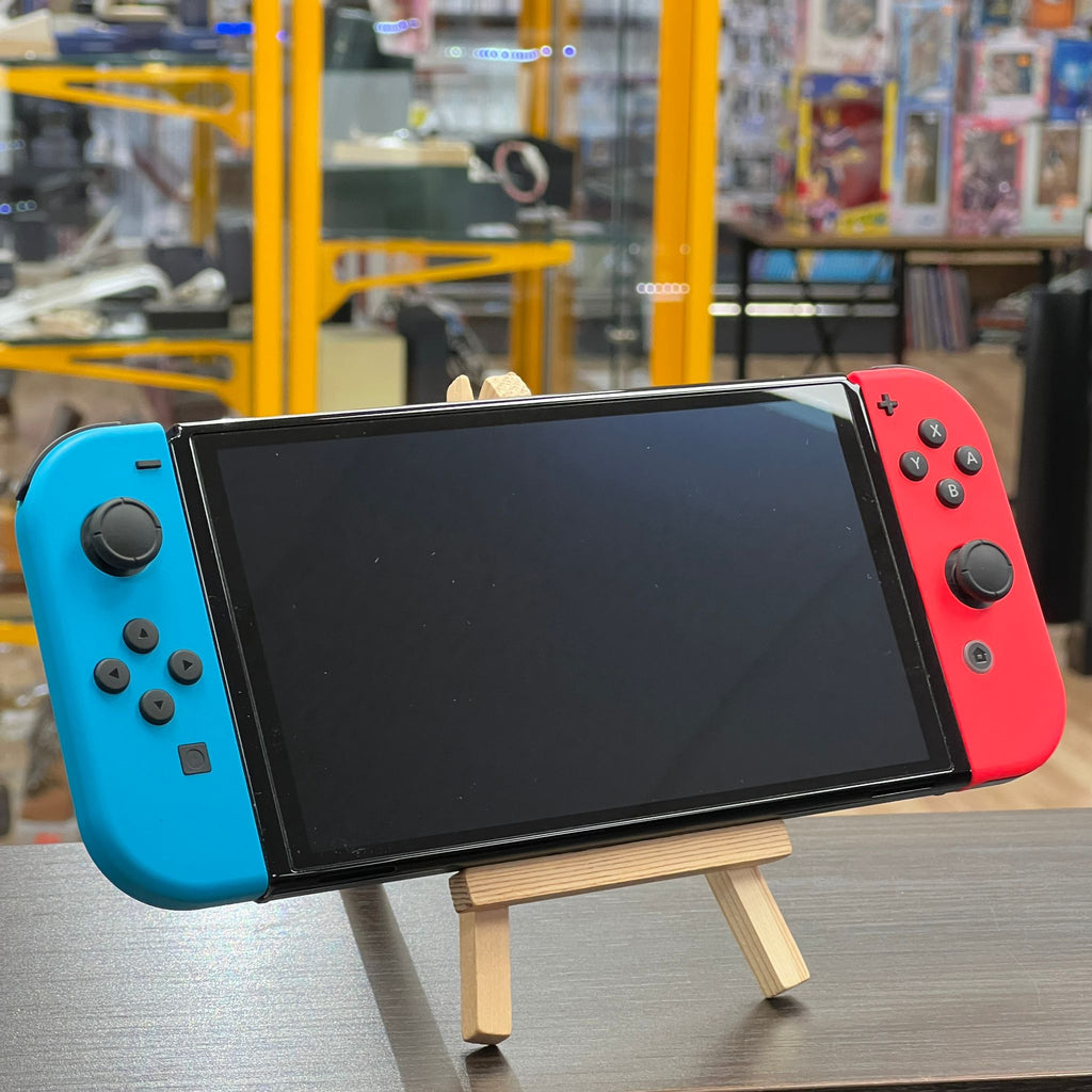 Nintendo Switch OLED Rouge/Bleu + housse, accessoires