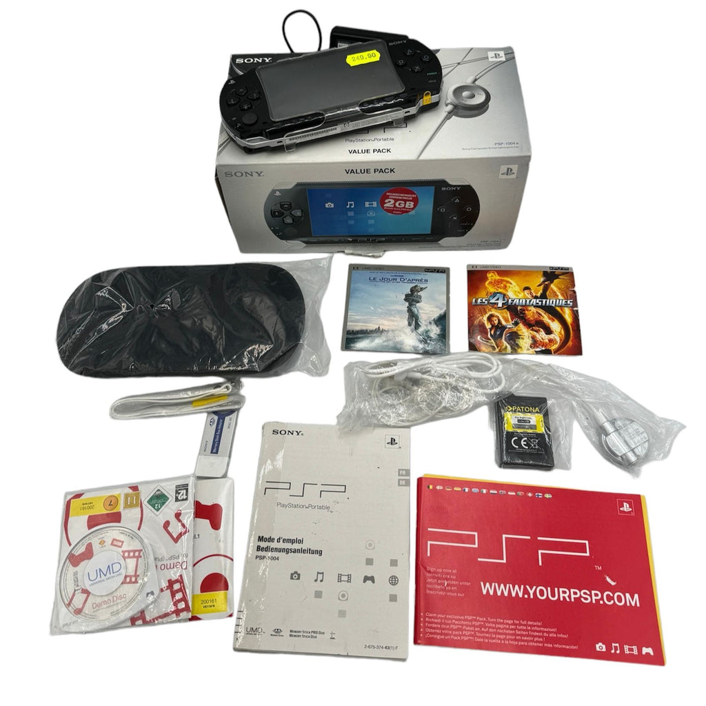 CONSOLE PSP VALUE PACK + BOÎTE, UMD VIDEO, BATTERIE SUPPLEMENTAIRE ET ACCESSOIRES